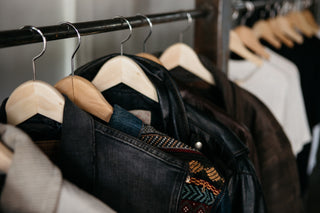 Artisan studio featuring bespoke fashion designs on a rack